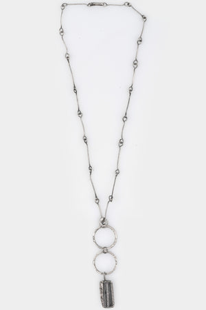 CUMA | Silver Necklace with Tourmaline pendant, shot on table