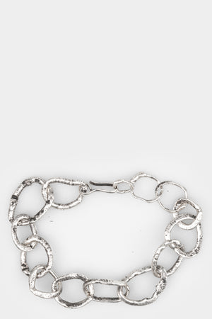 CUMA | Chunky silver bracelet, shot on table