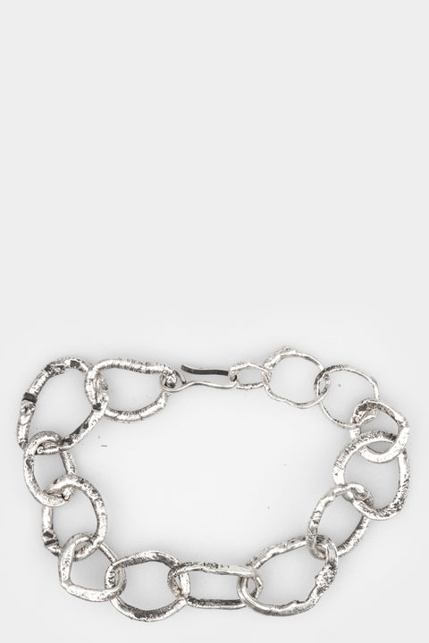 CUMA | Chunky silver bracelet, shot on table
