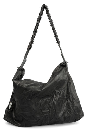 Isaac Sellam | AW24 - Large Crossbody leather bag, BALLADEUR, shot on table