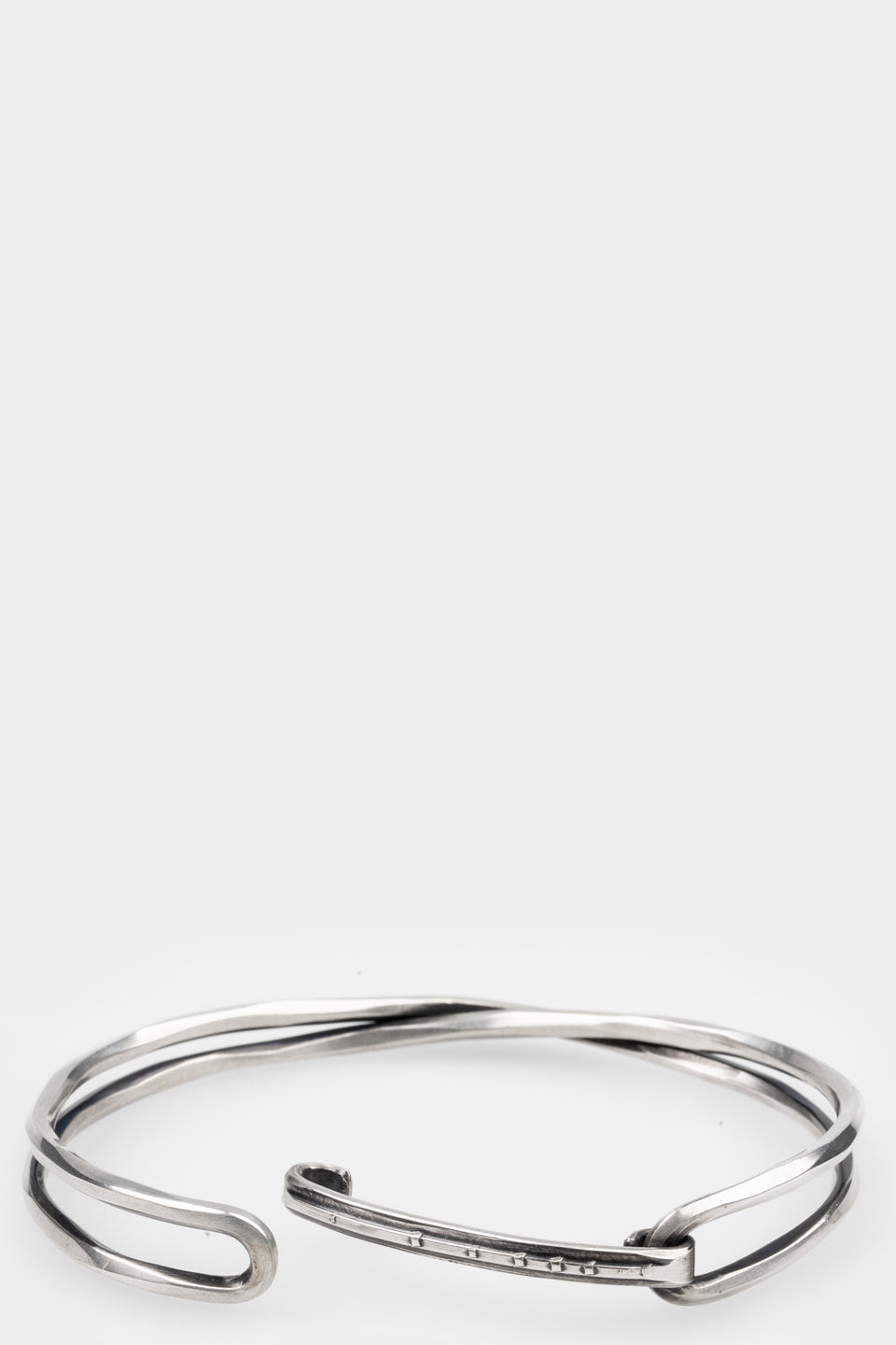 Crossed bangle bracelet