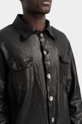 Buttoned up leather over shirt