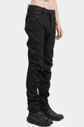 Resinated scar-stitched jeans