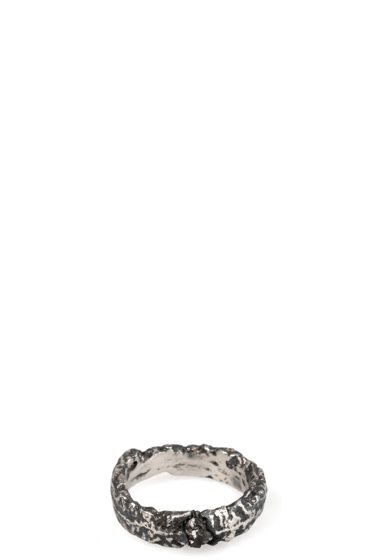Cuma | Silver band ring with black diamond, shot on table