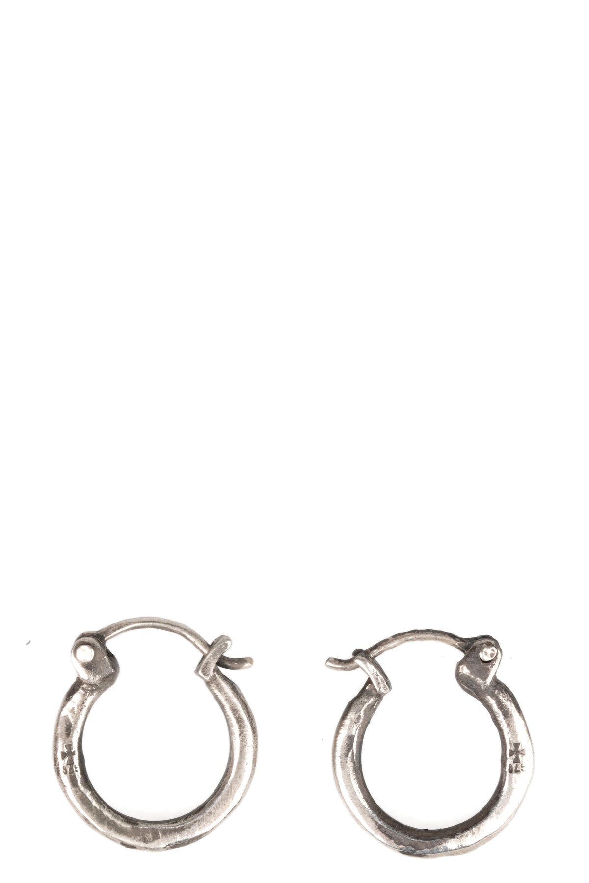 Certain Pace | Silver earrings, shot on table