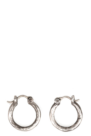 Certain Pace | Oval silver earrings, shot on table