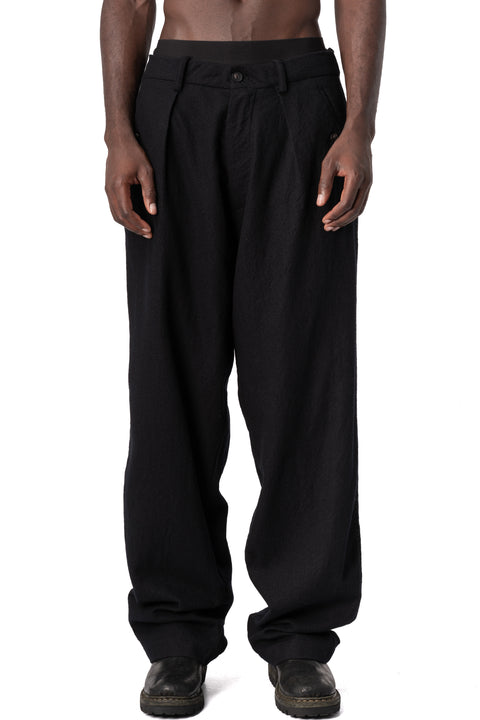 Masnada | AW26 - Pleated wool wide-leg trousers, Black M3722, front view on model