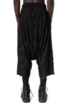Oversized low-crotch wrinkled jersey trousers