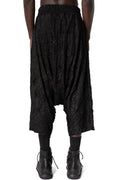 Oversized low-crotch wrinkled jersey trousers