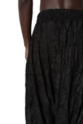 Oversized low-crotch wrinkled jersey trousers