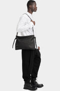 Stapled leather shoulder bag