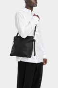 Stapled leather shoulder bag