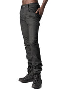 Coated stretch denim trousers