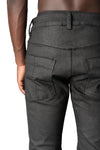 Coated stretch denim trousers